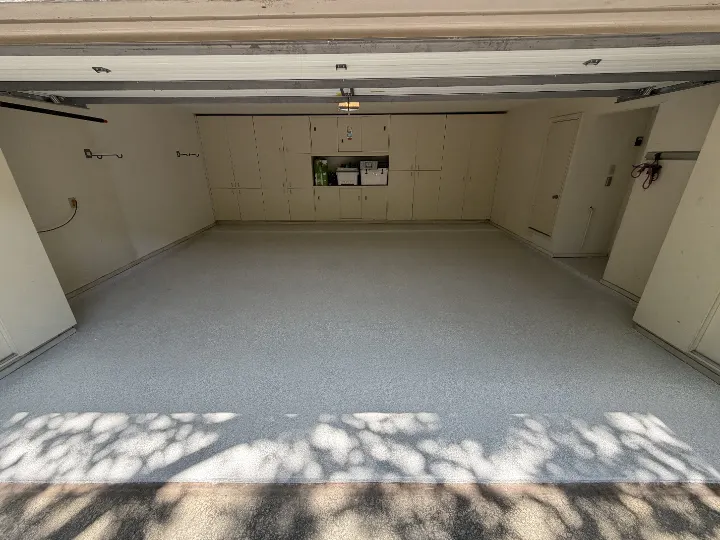 Completed 440-square-foot Dallas garage floor coated with a white Opal full-flake epoxy system.