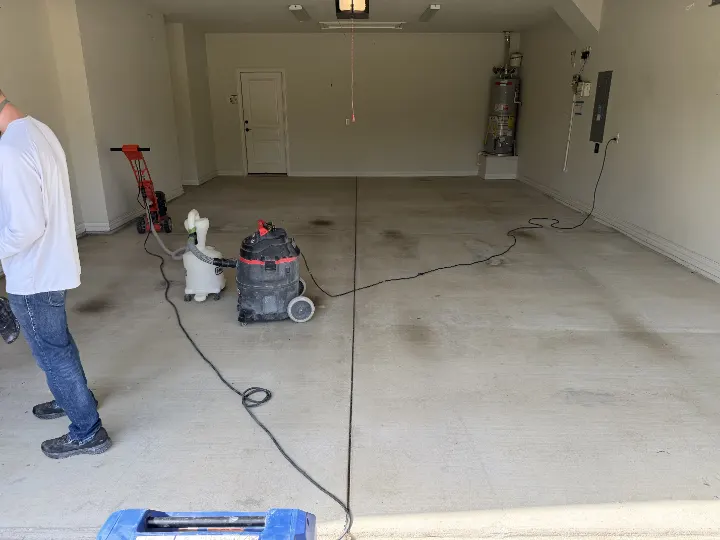 Detail photo of a garage floor coating project in Frisco, Texas, showing the existing concrete floor.