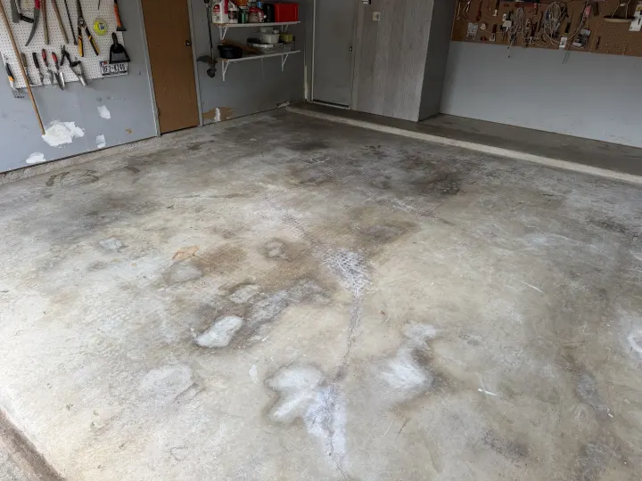 Before photo of the garage floor coating project in Euless, Texas.