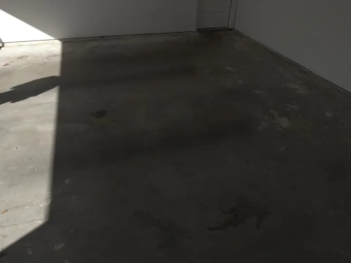 Before photo of a garage floor coating project in Allen, Texas.