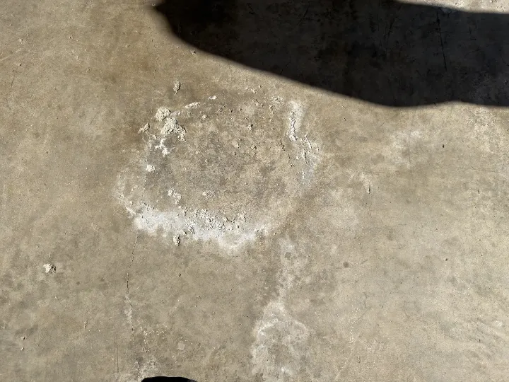 Detail of cracked and damaged concrete floor in Irving, Texas.