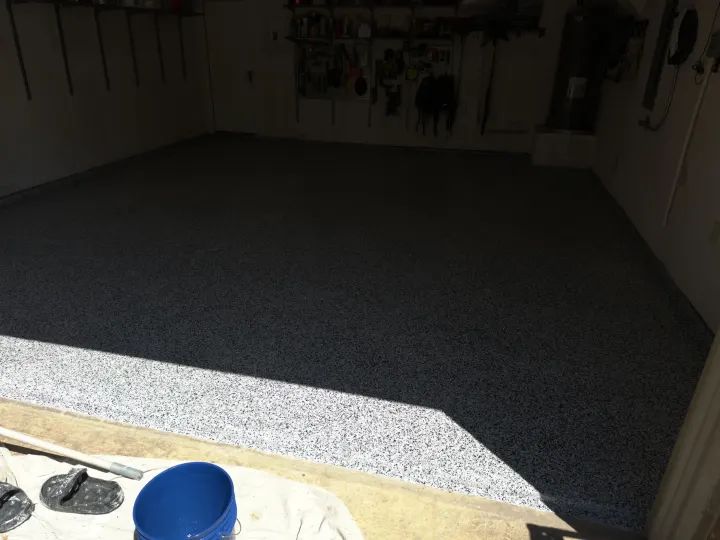 After photo of a 400 sq ft garage floor coating project in Aubrey, Texas, featuring a Domino flake finish.