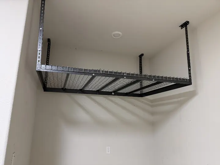 Installed overhead storage rack in a garage