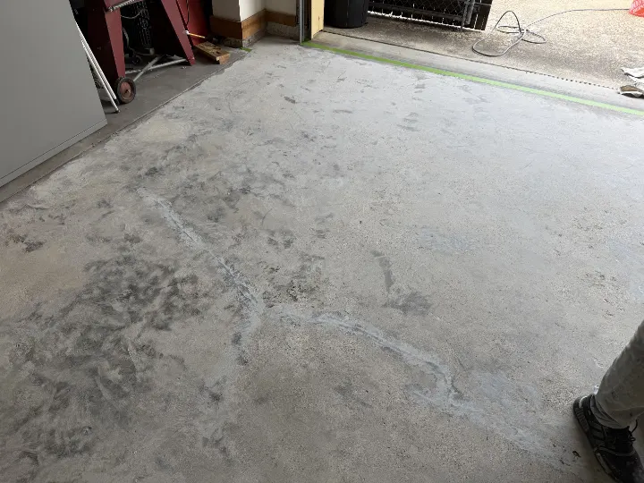 Repairing cracks in the garage floor in Irving, Texas.