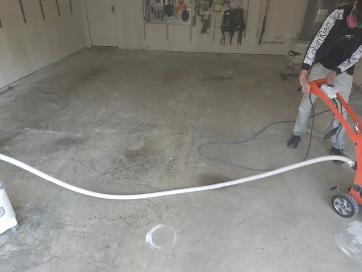Before photo of the garage floor coating project in Aubrey, Texas.
