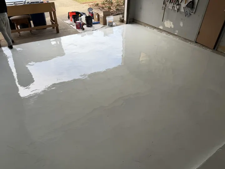 Moisture barrier application on the garage floor in Euless, Texas.