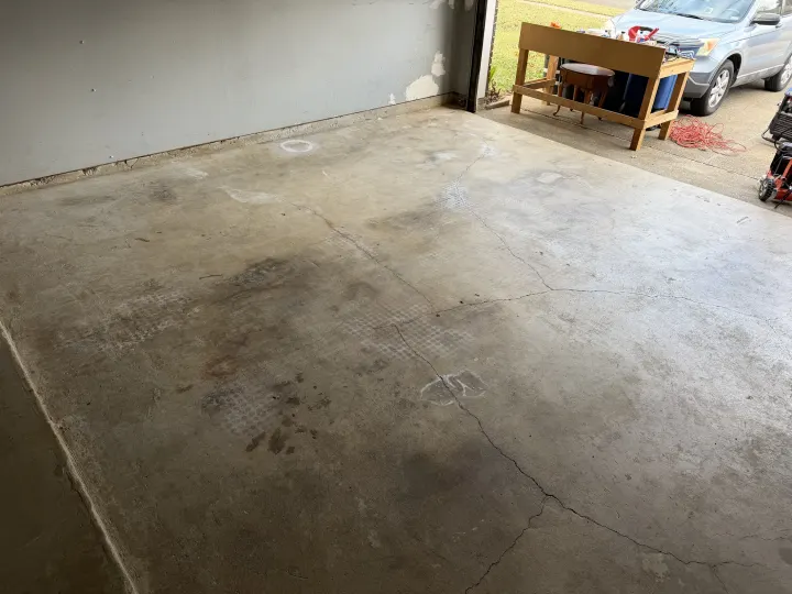 Before photo of a garage floor coating project in Euless, Texas.