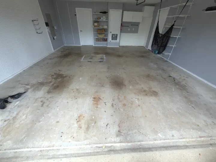 Dirty concrete garage floor in Plano, Texas.
