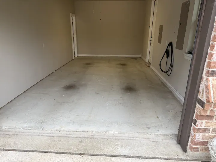 Before photo of the garage floor coating project in Colleyville, Texas.