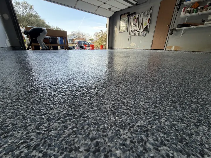 Detail photo of Custom Blend flake epoxy flooring in Euless, Texas.