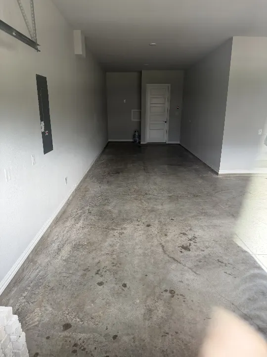 Before photo of a 600 sq ft garage floor in Prosper, Texas.