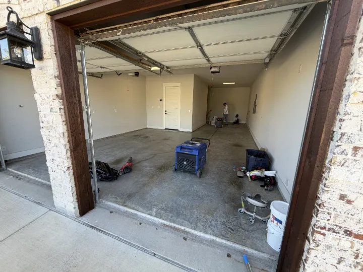 Garage interior before remodel with tools and equipment.