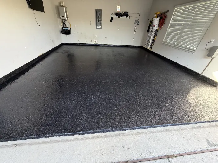 Garage floor with black epoxy coating and Carbon flakes