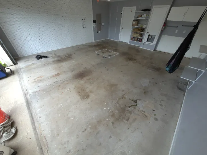 Dirty concrete garage floor in Plano, Texas.