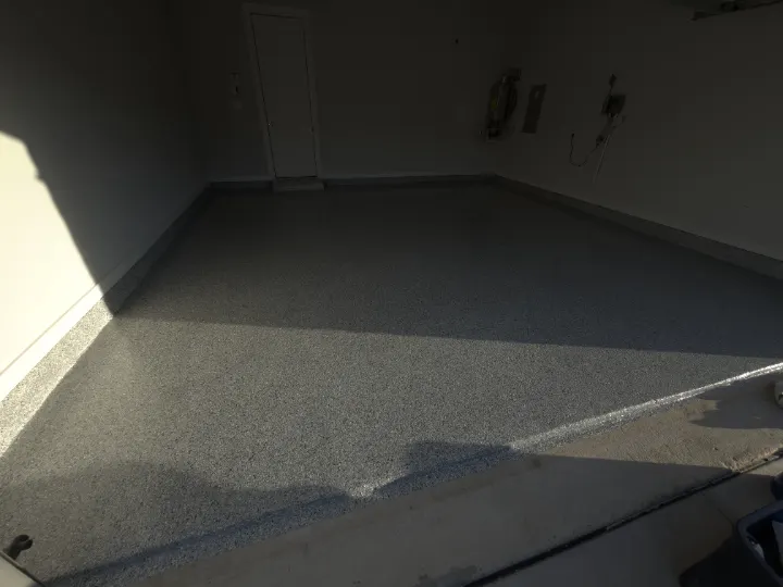Detail of Domino flake epoxy coating on a garage floor.