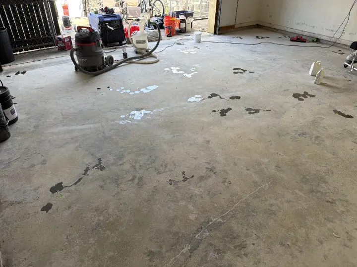 Repairing cracks and pits on the Irving garage floor.