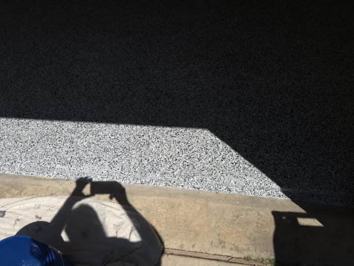 Detail photo of Domino flake epoxy floor coating in Aubrey, Texas.