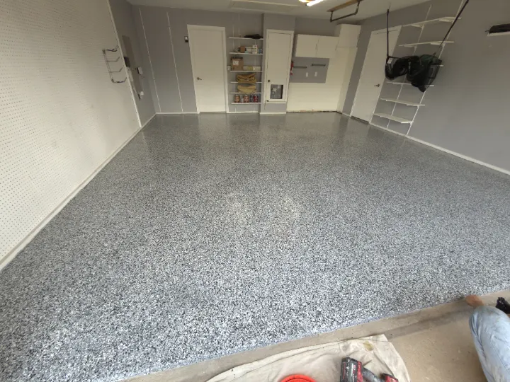 Finished Domino flake epoxy floor in Plano, Texas garage.